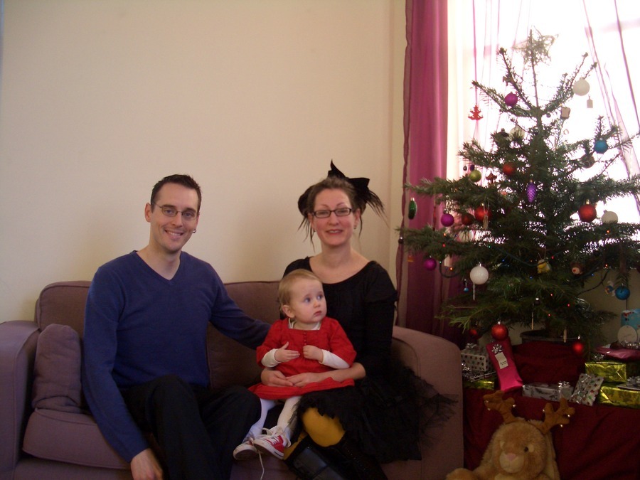 Jamie, Tyler, and Pascale next to the tree