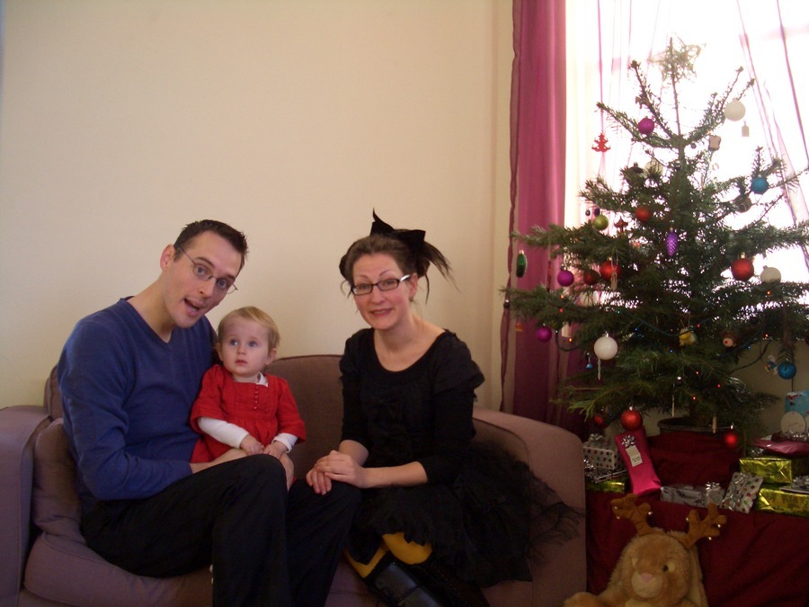 Jamie, Tyler, and Pascale next to the tree