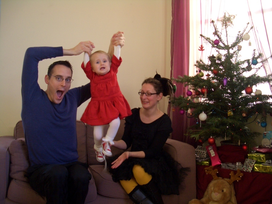 Jamie, Tyler, and Pascale next to the tree