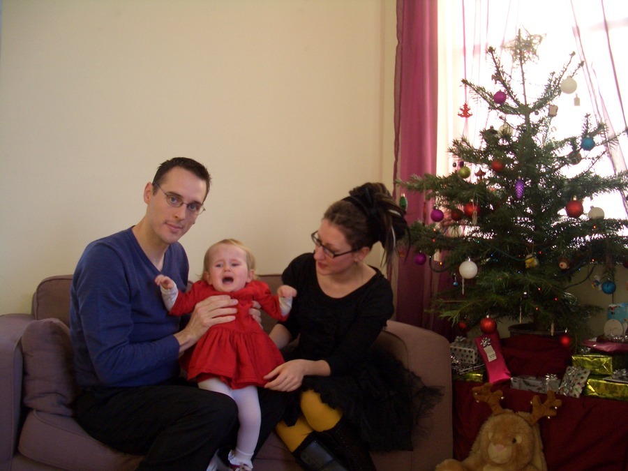Jamie, Tyler, and Pascale next to the tree