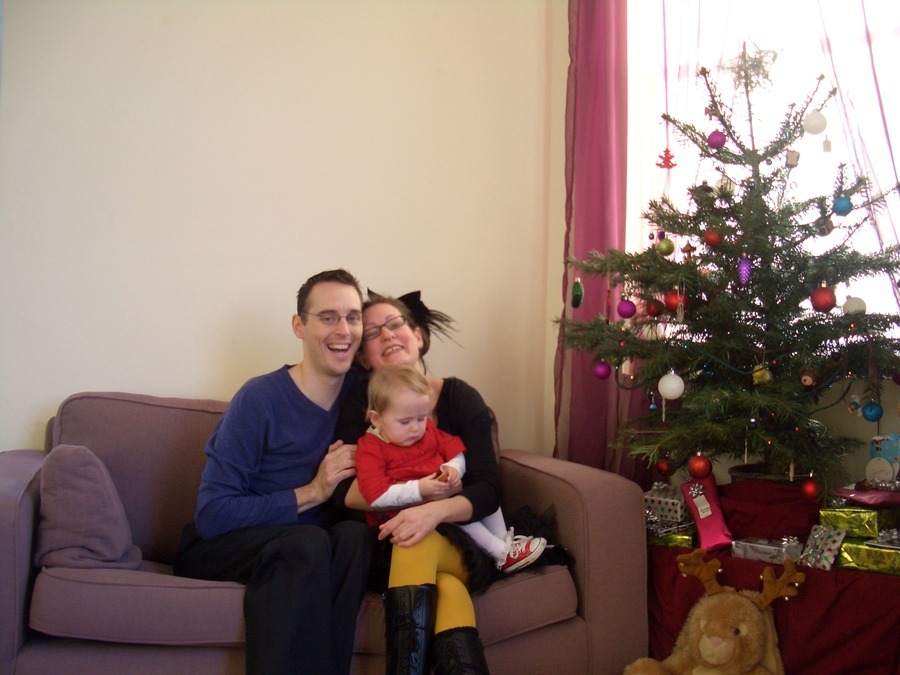 Jamie, Tyler, and Pascale next to the tree
