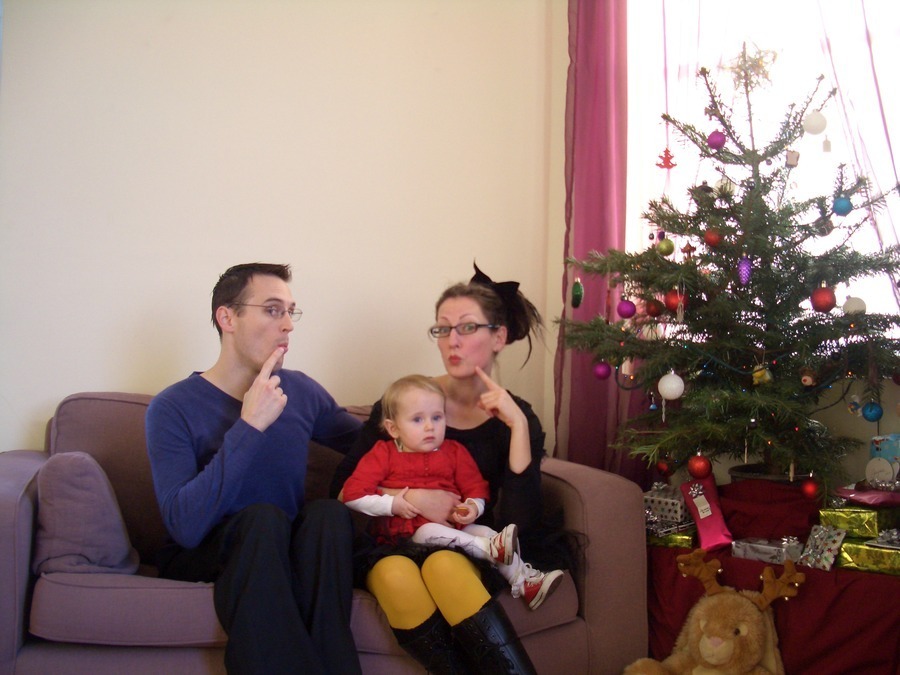 Jamie, Tyler, and Pascale next to the tree