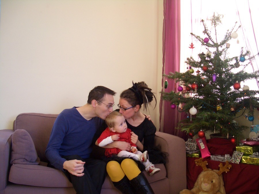 Jamie, Tyler, and Pascale next to the tree