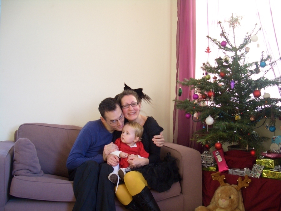 Jamie, Tyler, and Pascale next to the tree