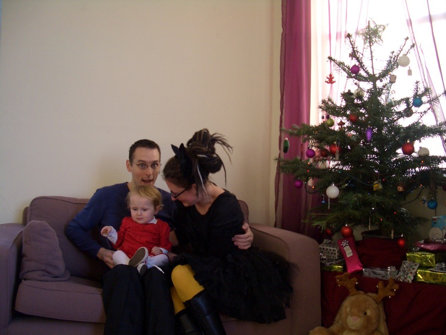 Jamie, Tyler, and Pascale next to the tree