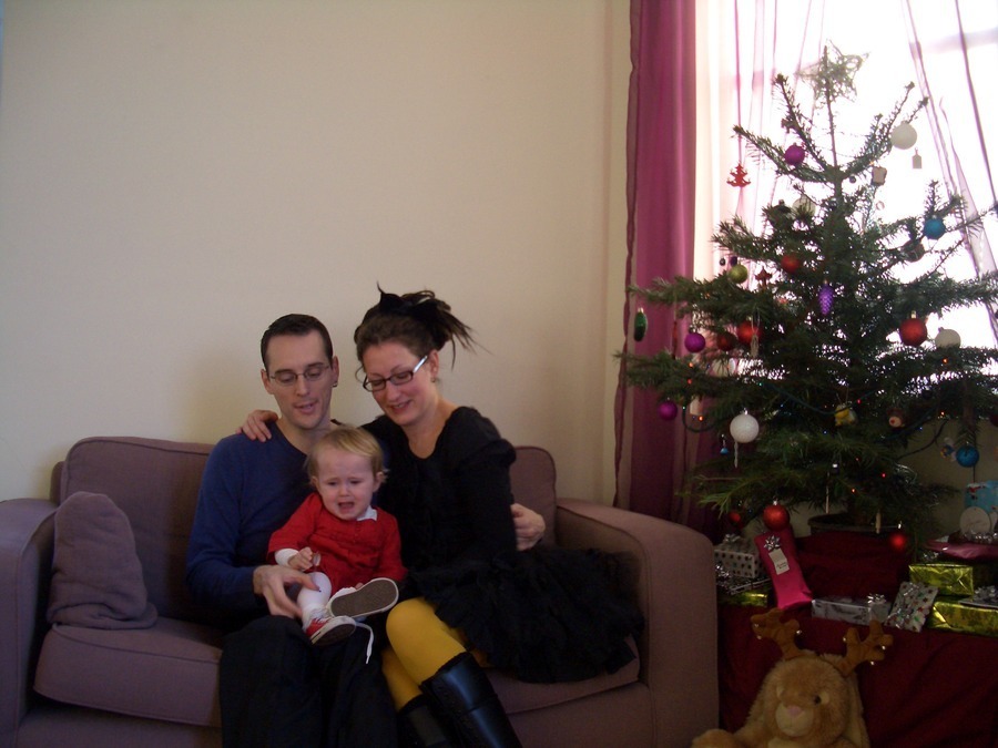 Jamie, Tyler, and Pascale next to the tree