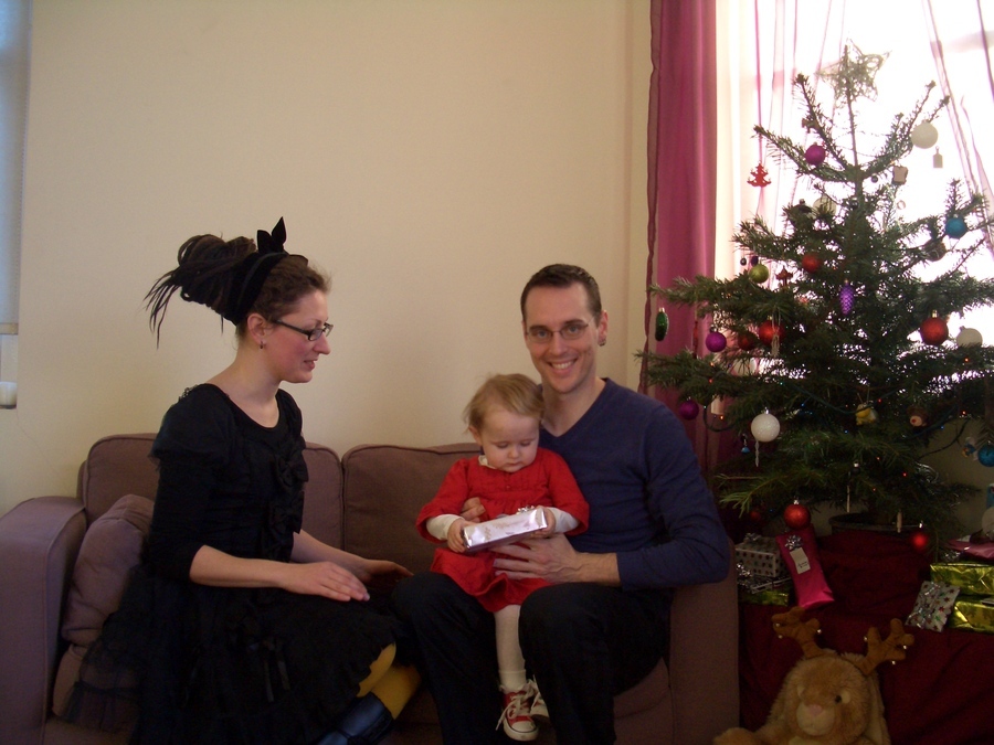 Jamie, Tyler, and Pascale next to the tree