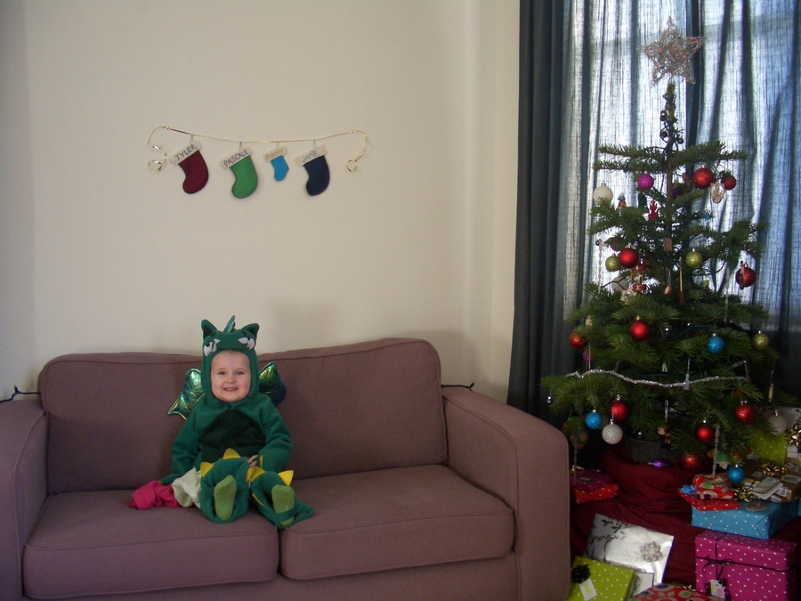 Jamie, Tyler, and Pascale next to the tree