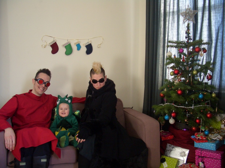 Jamie, Tyler, and Pascale next to the tree
