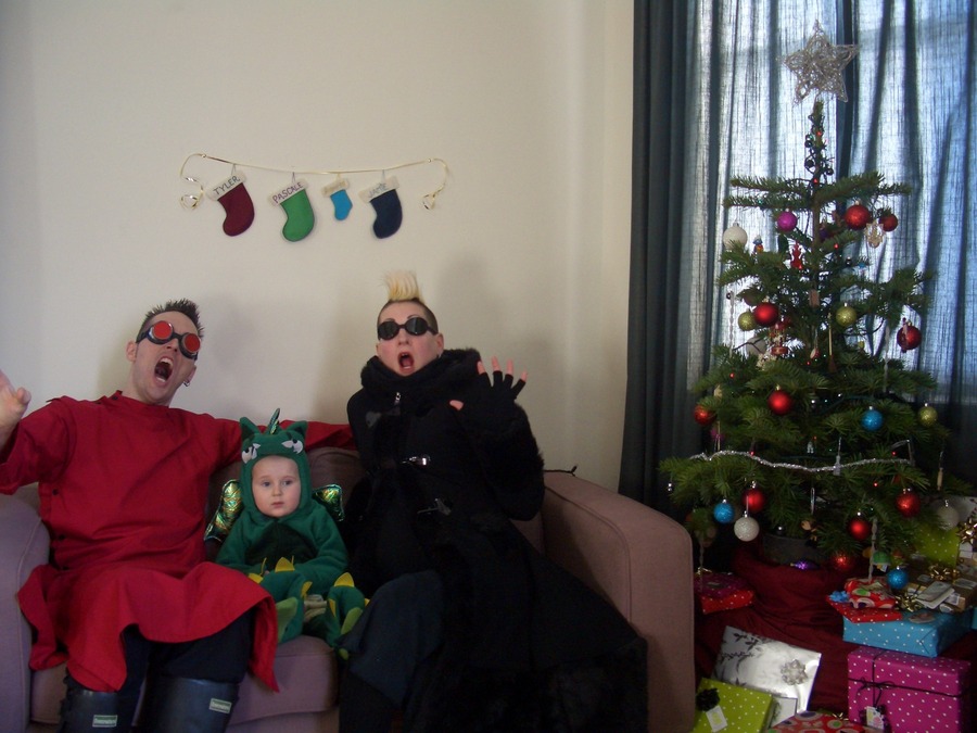 Jamie, Tyler, and Pascale next to the tree