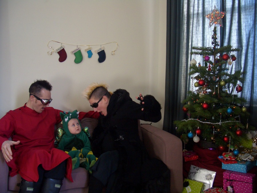 Jamie, Tyler, and Pascale next to the tree