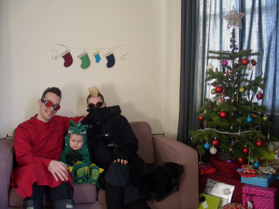 Jamie, Tyler, and Pascale next to the tree