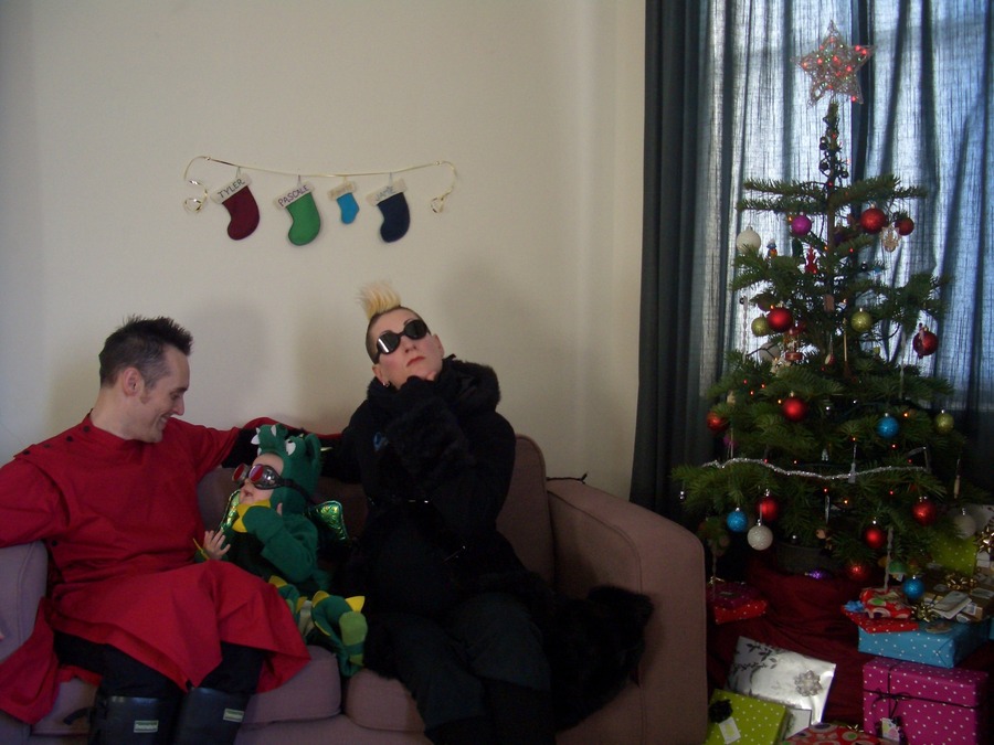 Jamie, Tyler, and Pascale next to the tree