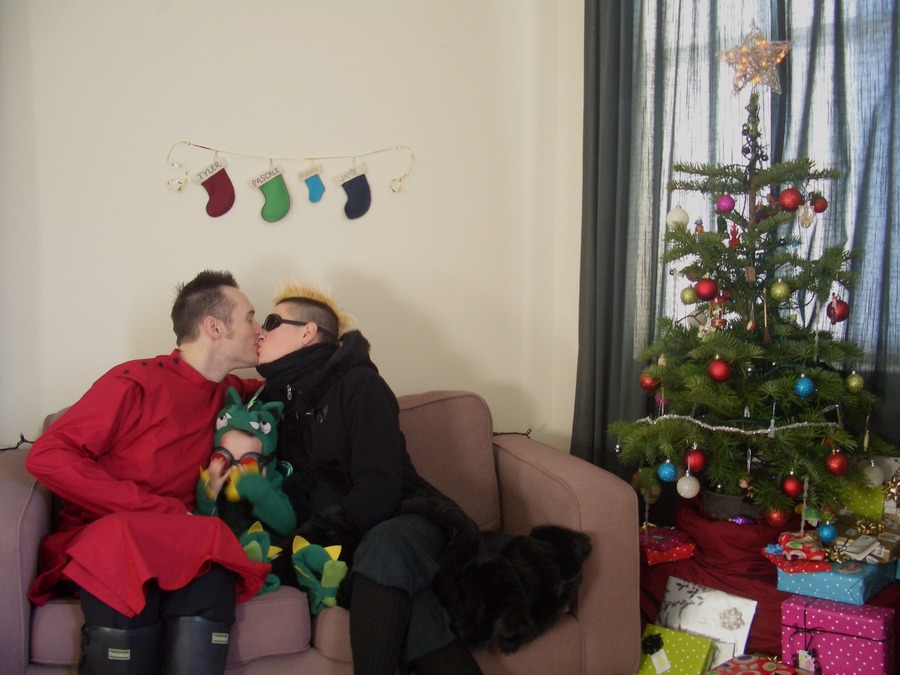 Jamie, Tyler, and Pascale next to the tree