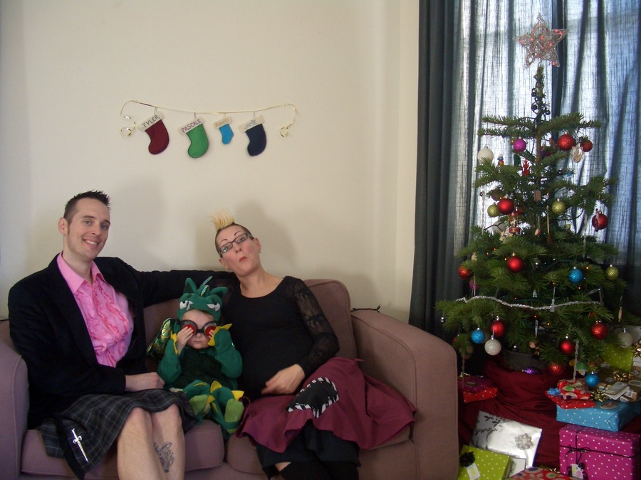 Jamie, Tyler, and Pascale next to the tree