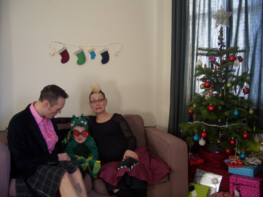 Jamie, Tyler, and Pascale next to the tree