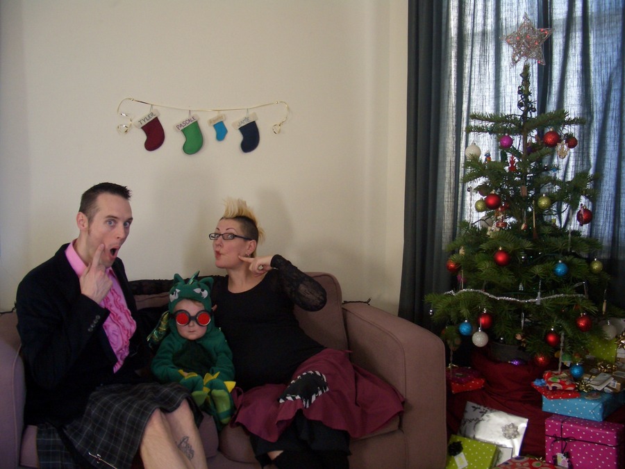 Jamie, Tyler, and Pascale next to the tree