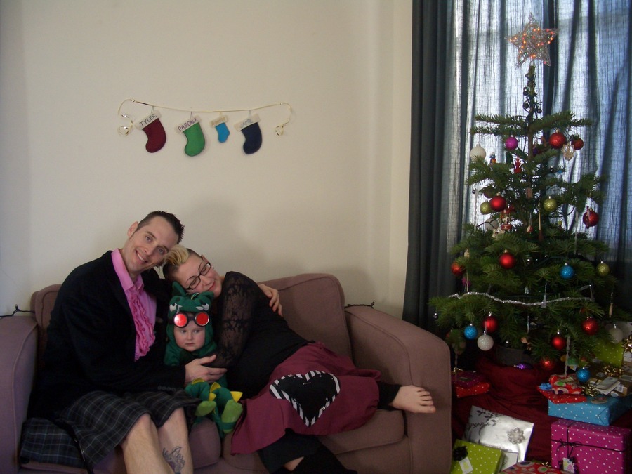 Jamie, Tyler, and Pascale next to the tree