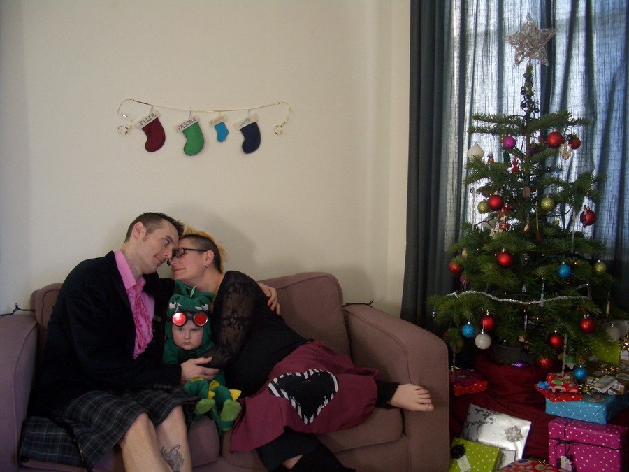 Jamie, Tyler, and Pascale next to the tree