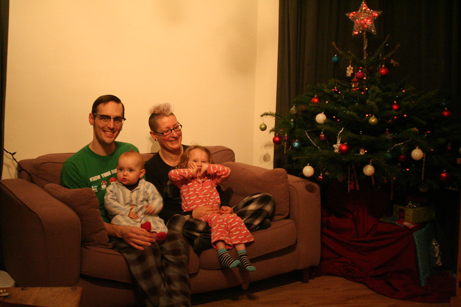 Jamie, Tyler, Pascale, and Frances next to the tree