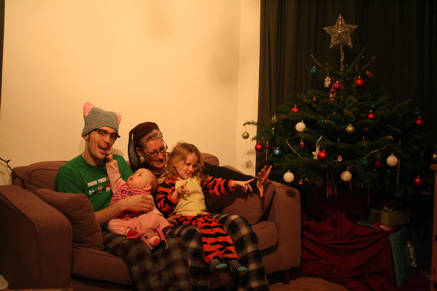 Jamie, Tyler, Pascale, and Frances next to the tree