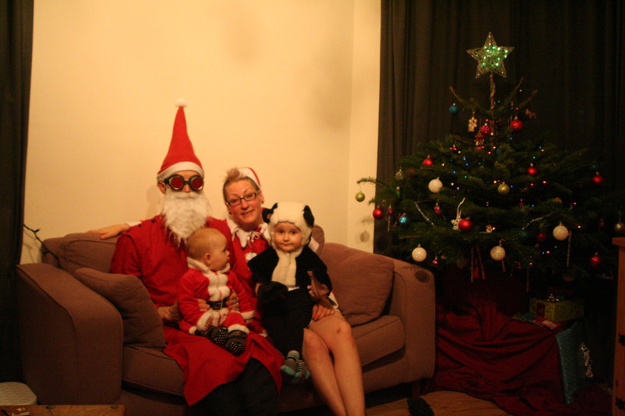 Jamie, Tyler, Pascale, and Frances next to the tree