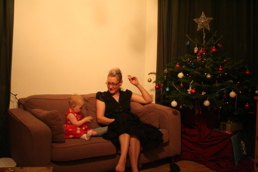 Jamie, Tyler, Pascale, and Frances next to the tree