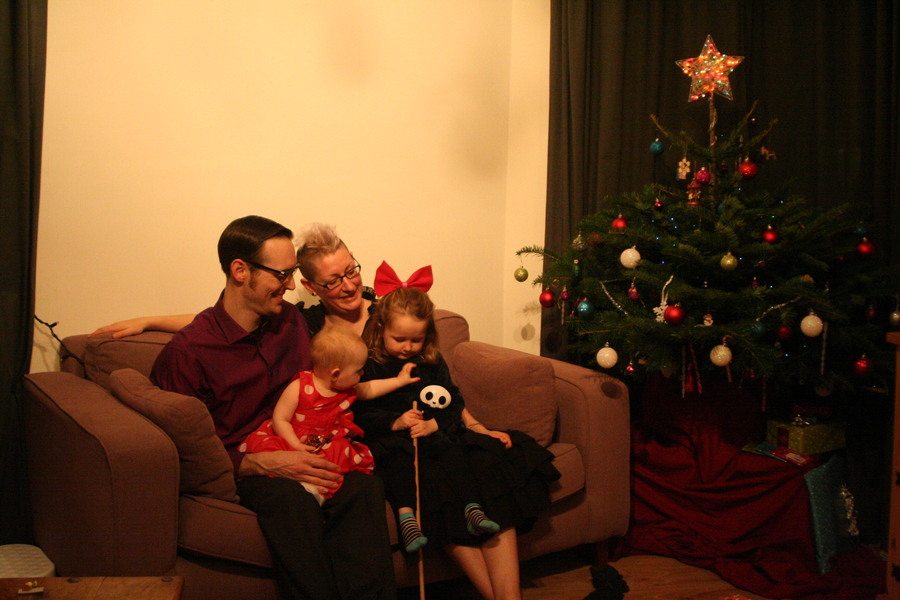 Jamie, Tyler, Pascale, and Frances next to the tree