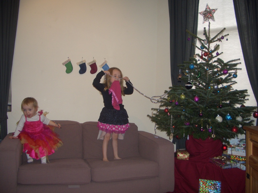 Jamie, Tyler, Pascale, and Frances next to the tree