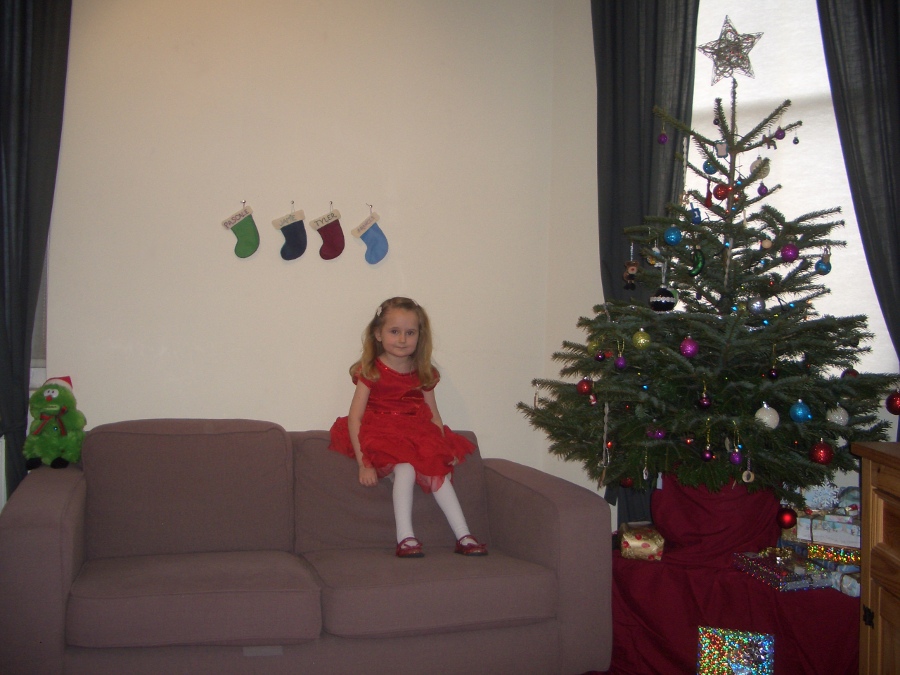 Jamie, Tyler, Pascale, and Frances next to the tree