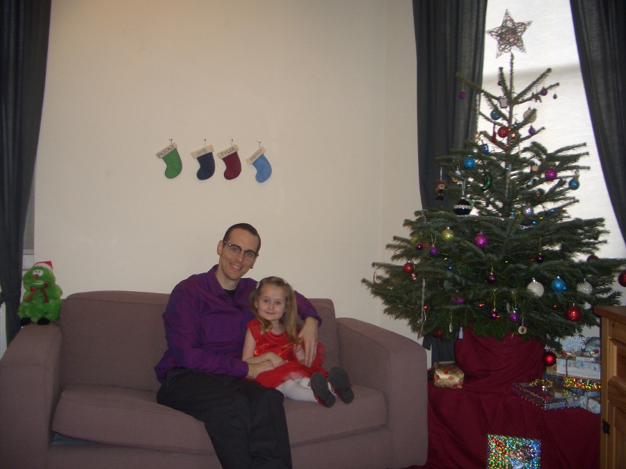 Jamie, Tyler, Pascale, and Frances next to the tree