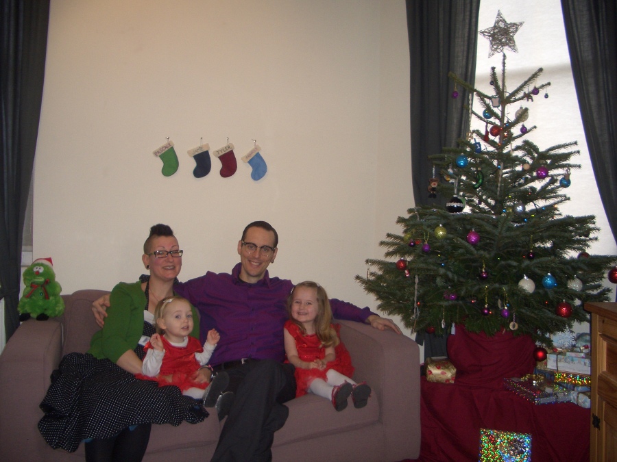 Jamie, Tyler, Pascale, and Frances next to the tree