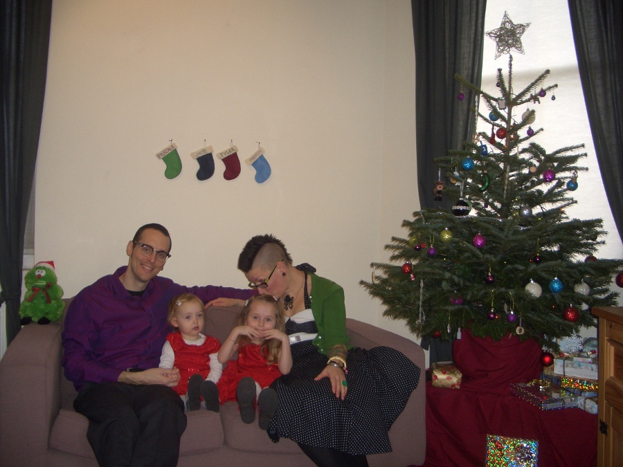 Jamie, Tyler, Pascale, and Frances next to the tree