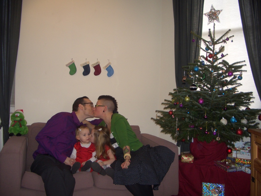 Jamie, Tyler, Pascale, and Frances next to the tree