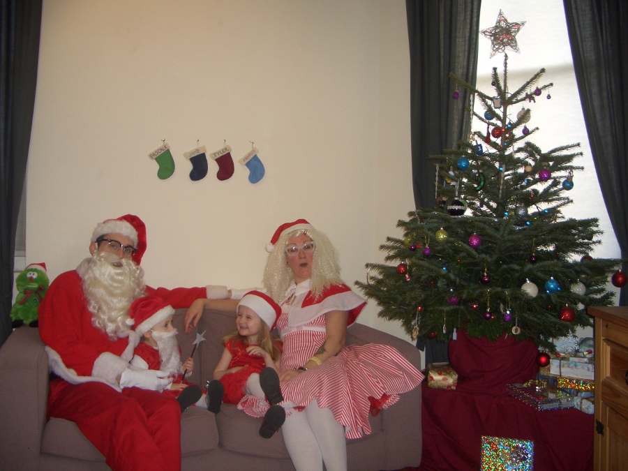 Jamie, Tyler, Pascale, and Frances next to the tree