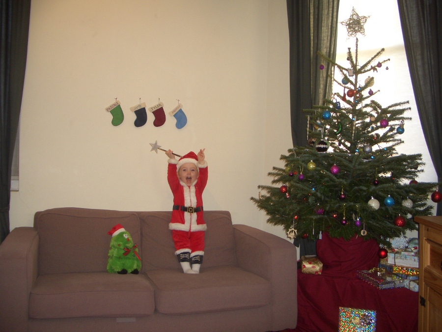 Jamie, Tyler, Pascale, and Frances next to the tree