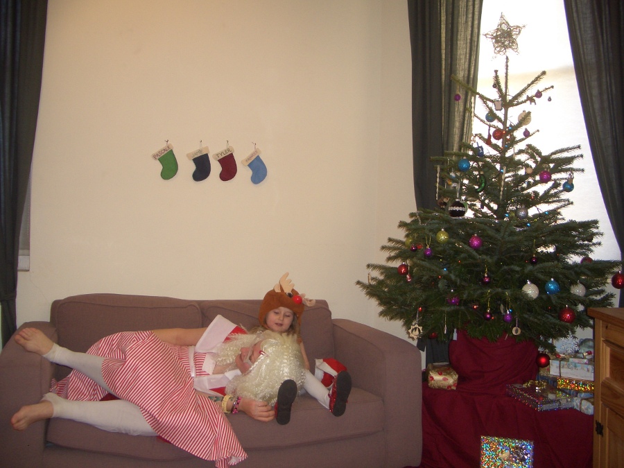 Jamie, Tyler, Pascale, and Frances next to the tree