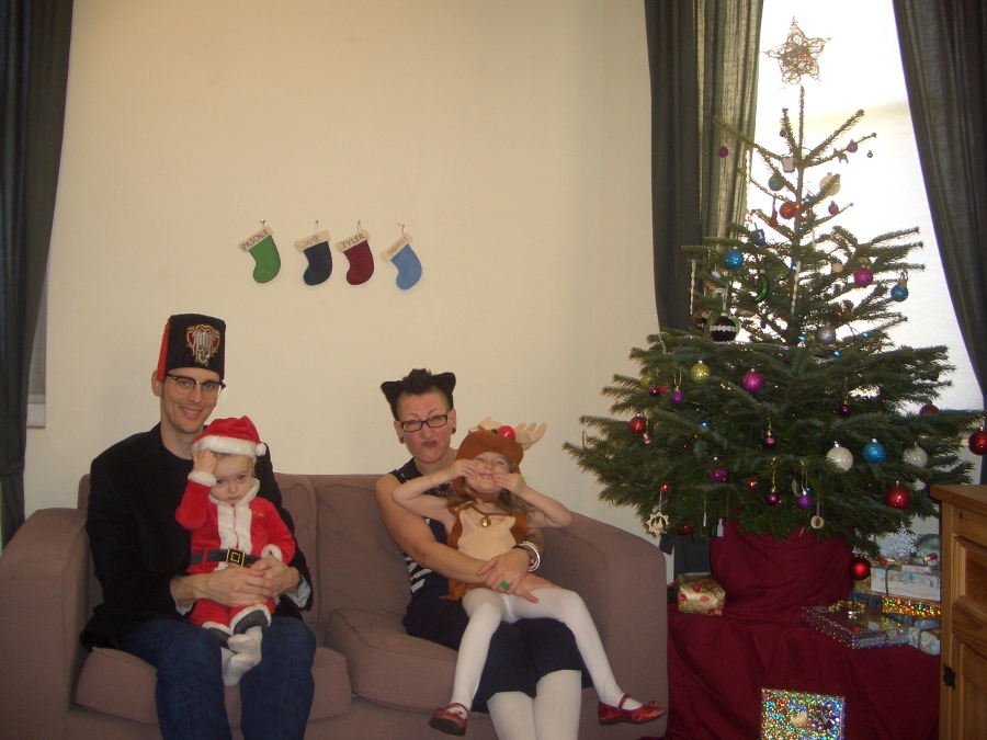 Jamie, Tyler, Pascale, and Frances next to the tree