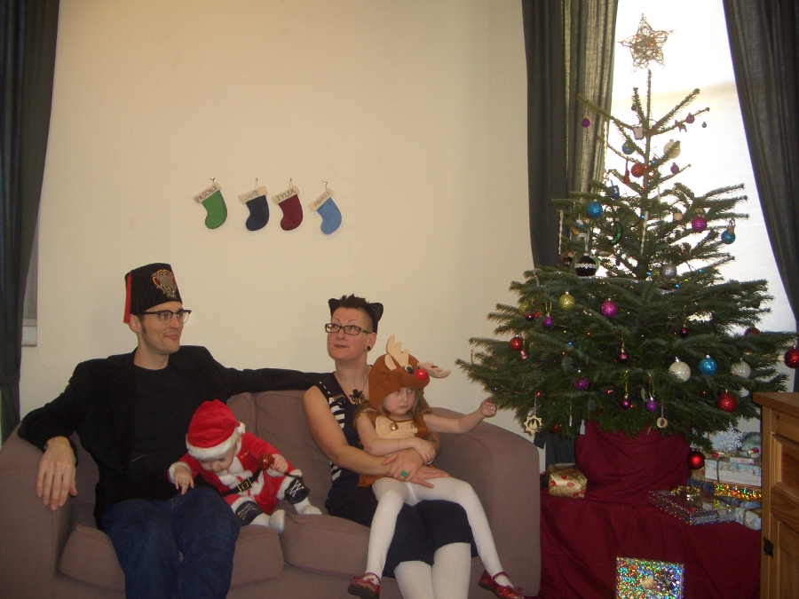 Jamie, Tyler, Pascale, and Frances next to the tree