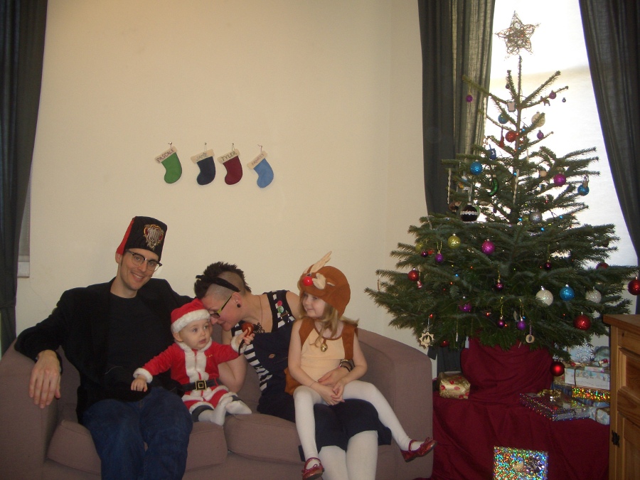 Jamie, Tyler, Pascale, and Frances next to the tree