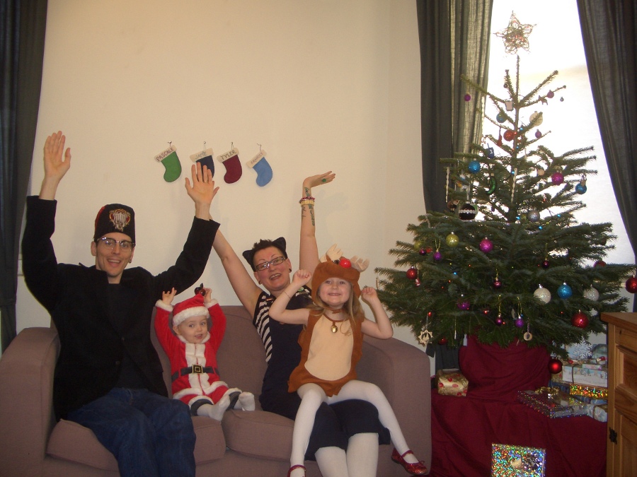 Jamie, Tyler, Pascale, and Frances next to the tree