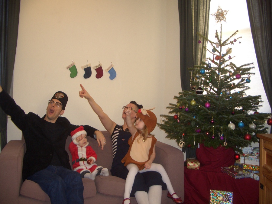Jamie, Tyler, Pascale, and Frances next to the tree