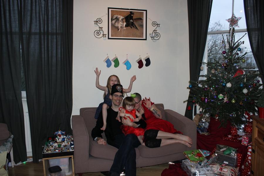 Jamie, Tyler, Pascale, and Frances next to the tree