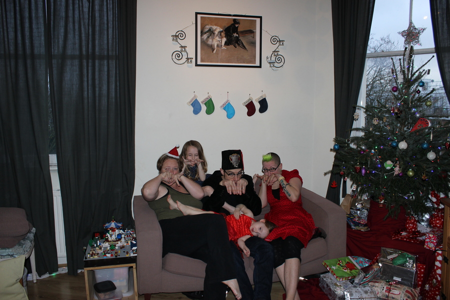 Jamie, Tyler, Pascale, and Frances next to the tree