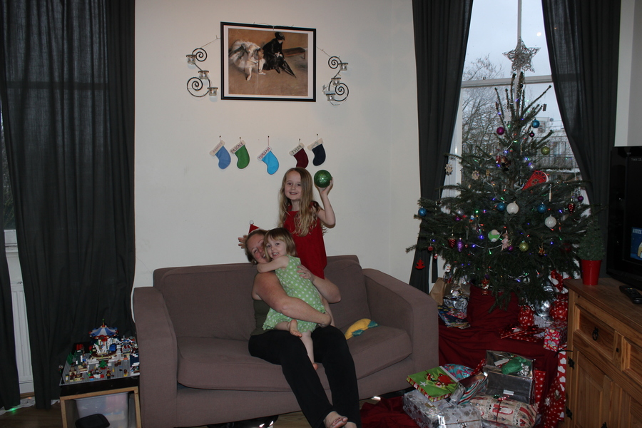 Jamie, Tyler, Pascale, and Frances next to the tree