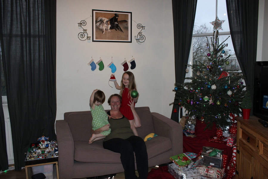 Jamie, Tyler, Pascale, and Frances next to the tree