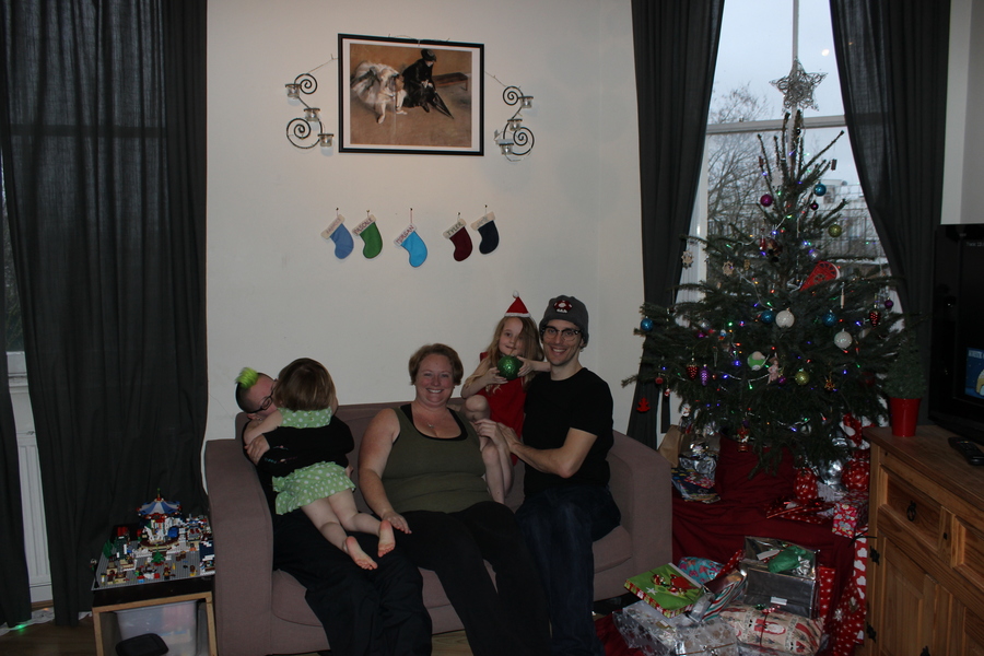 Jamie, Tyler, Pascale, and Frances next to the tree